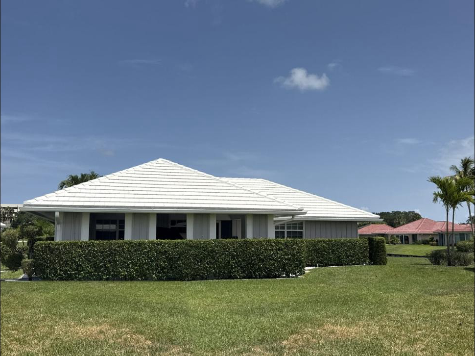 After: The same Atlantis, FL flat tile roof after soft-wash cleaning