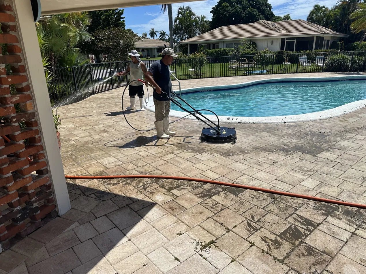 Before: Dirty HOA pool deck before cleaning in Atlantis, FL