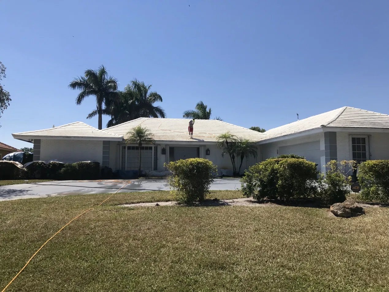 Soft-wash roof cleaning - flat tile roof, Atlantis, FL