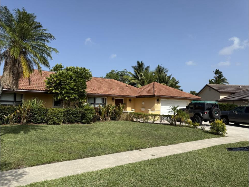 After: Same barrel tile roof in Boca Raton, FL after soft-wash cleaning — clean terracotta restored, June 2025
