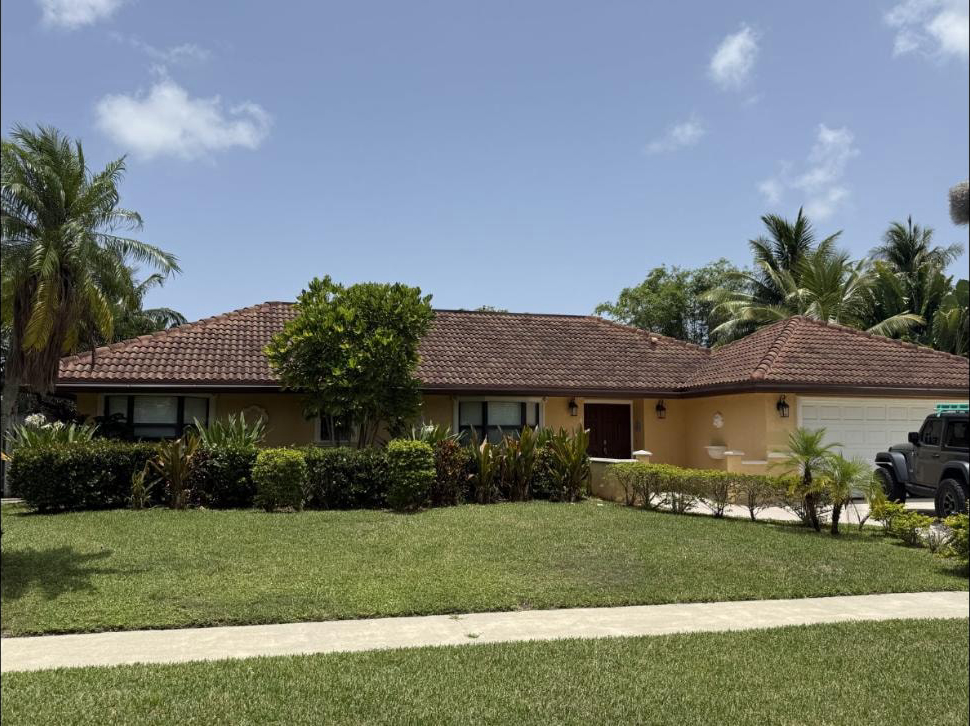 Before: Barrel tile roof in Boca Raton, FL dark and algae-stained before soft-wash cleaning, June 2025