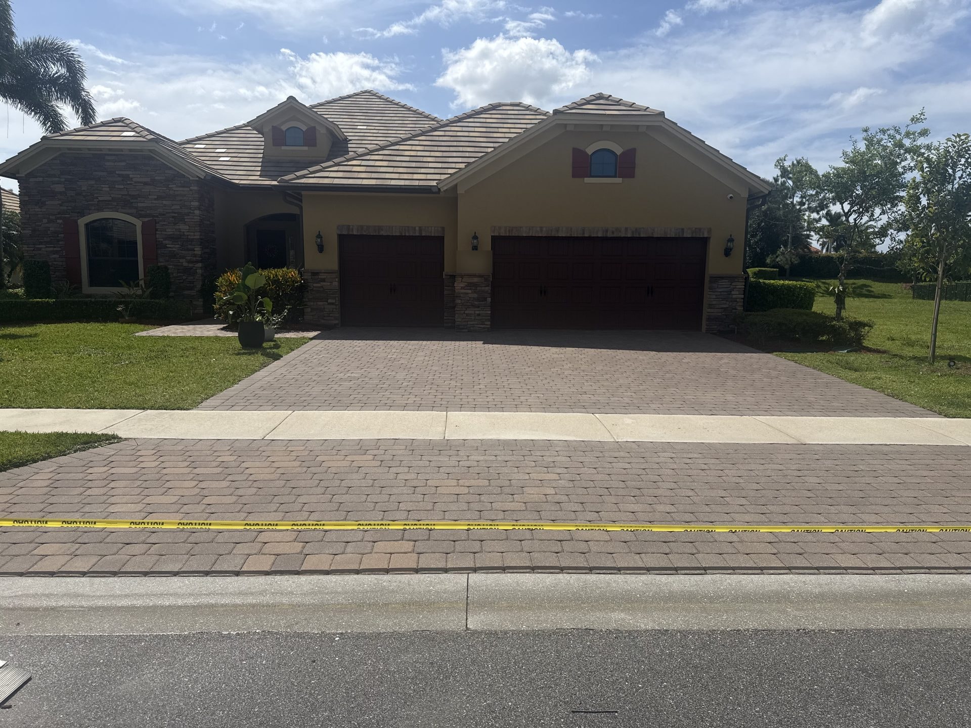 Before: Brick paver driveway with faded and dulled color before cleaning and sealing, Wellington, FL