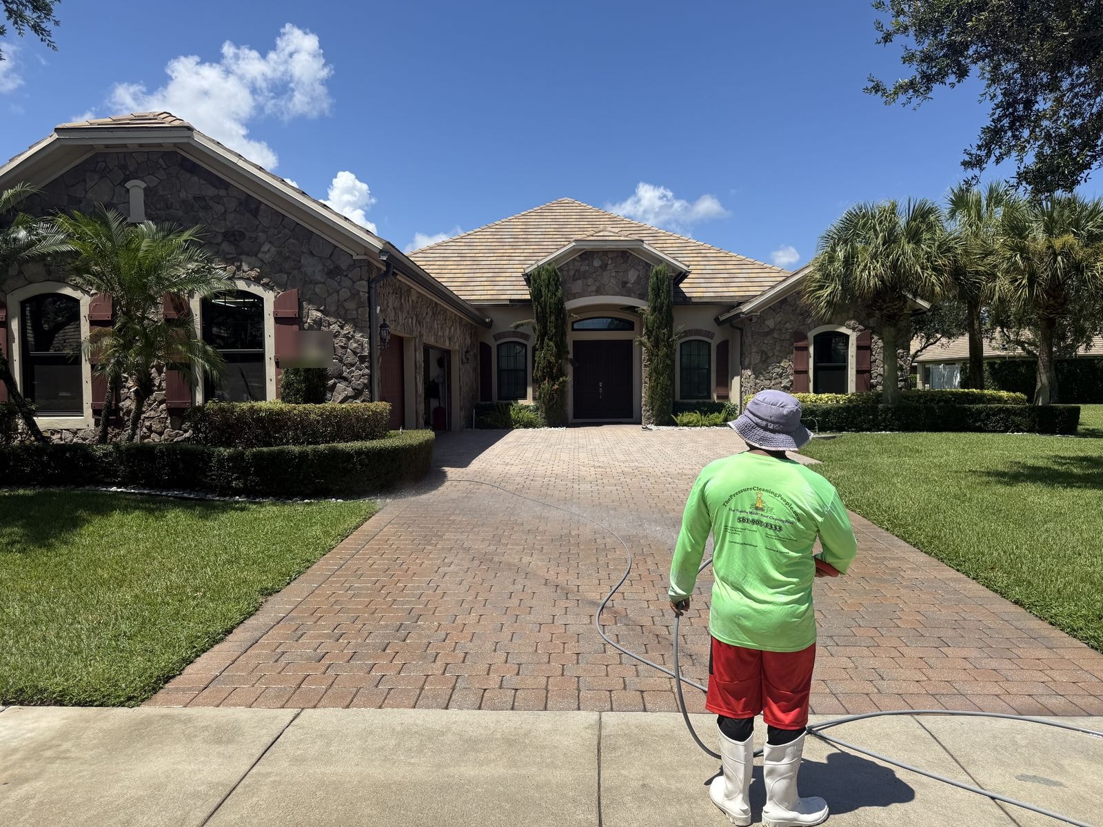 After: Concrete paver driveway after cleaning and sealing, color restored and surface brightened