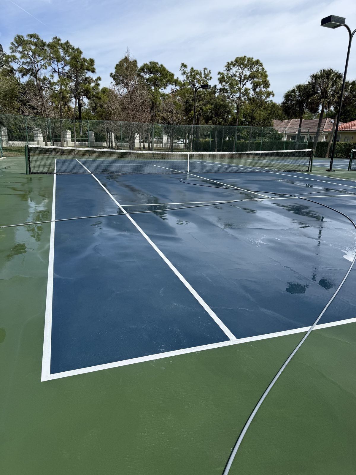 After: Sports court soft-wash cleaning before and after in Lake Worth, Florida