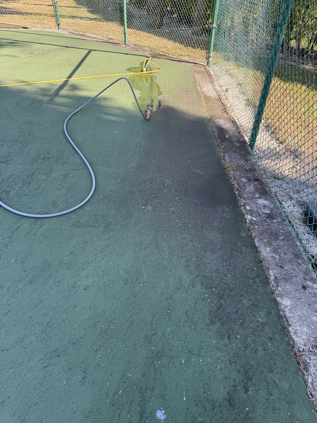 Before: Sports court soft-wash cleaning before and after in Lake Worth, Florida
