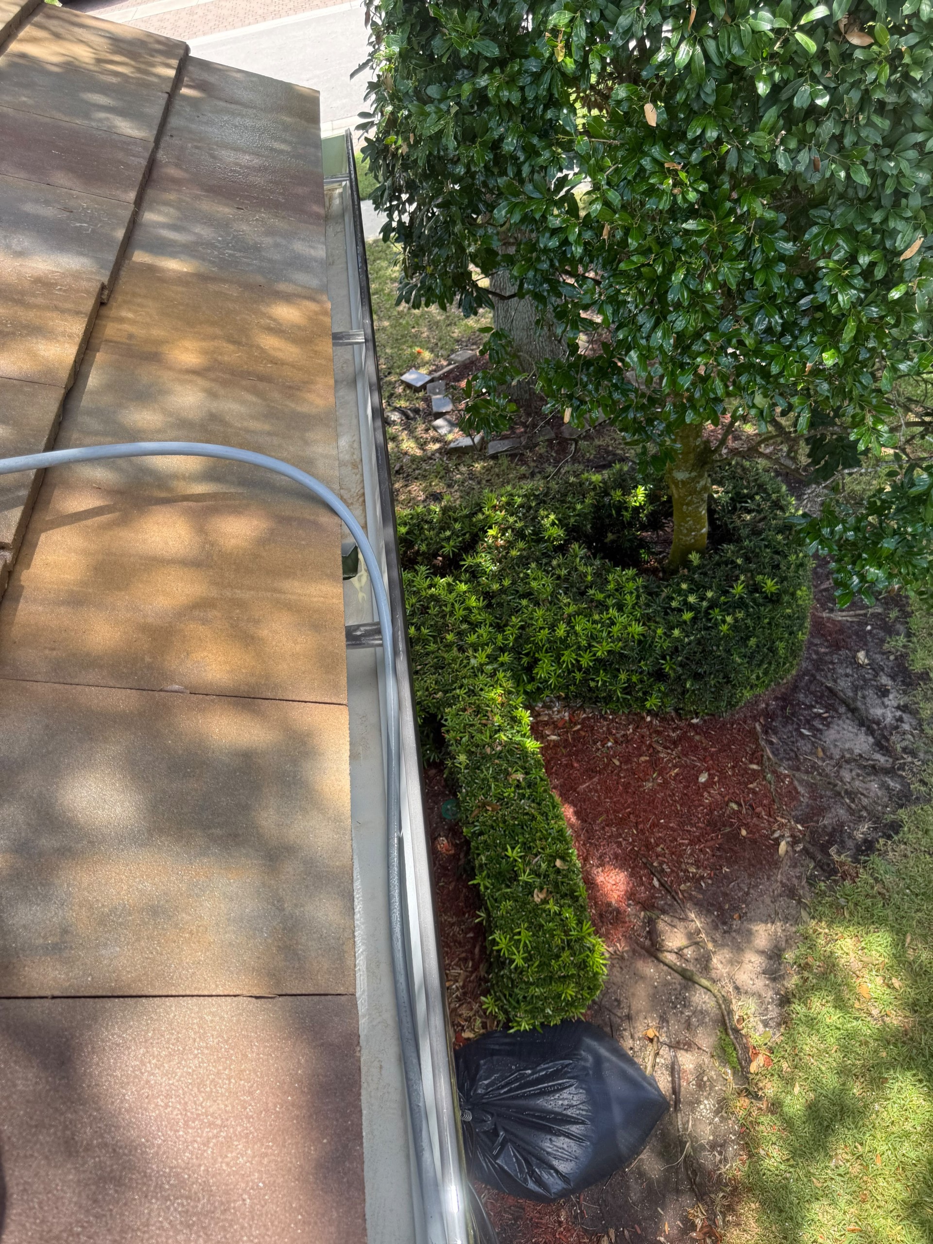 After: The same gutters clear and flushed after cleaning, Wellington, FL