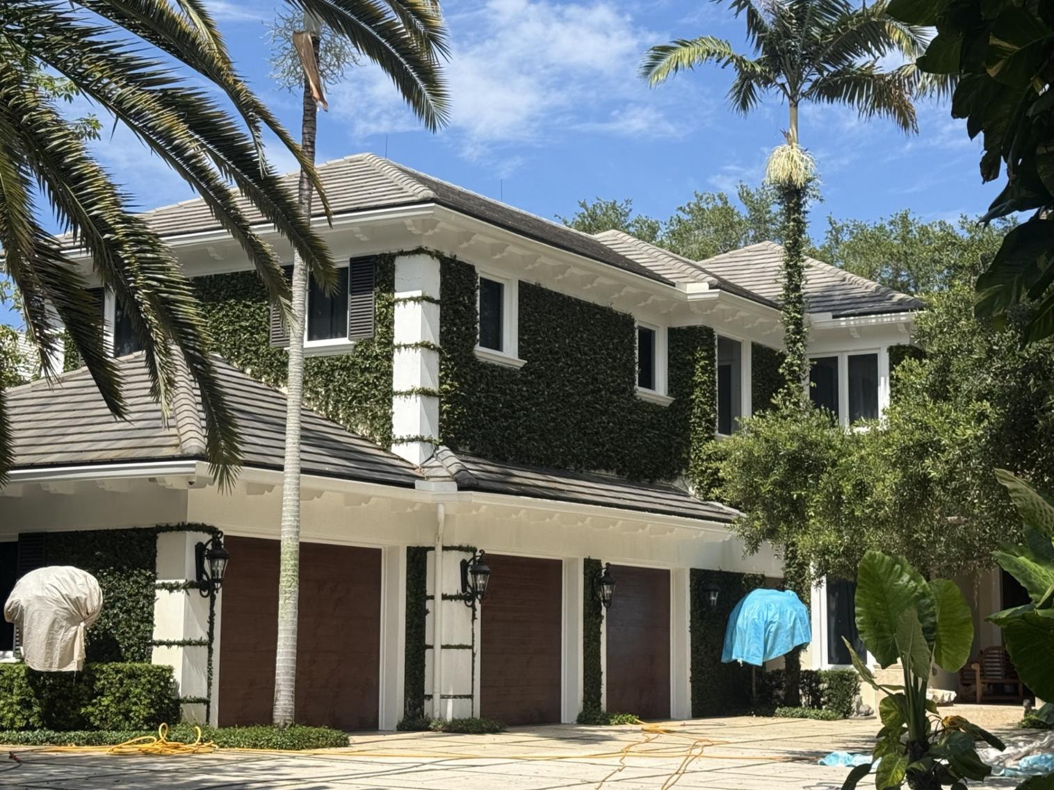 Flat tile roof on a two-story Palm Beach Gardens, FL home after soft-wash cleaning