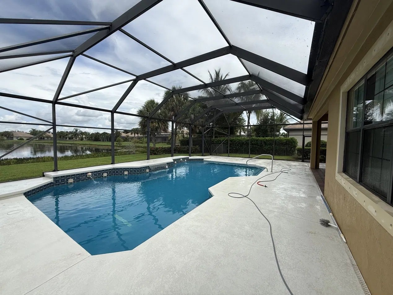 After: Pool deck pressure washing and screen enclosure cleaning - Wellington, FL — after service