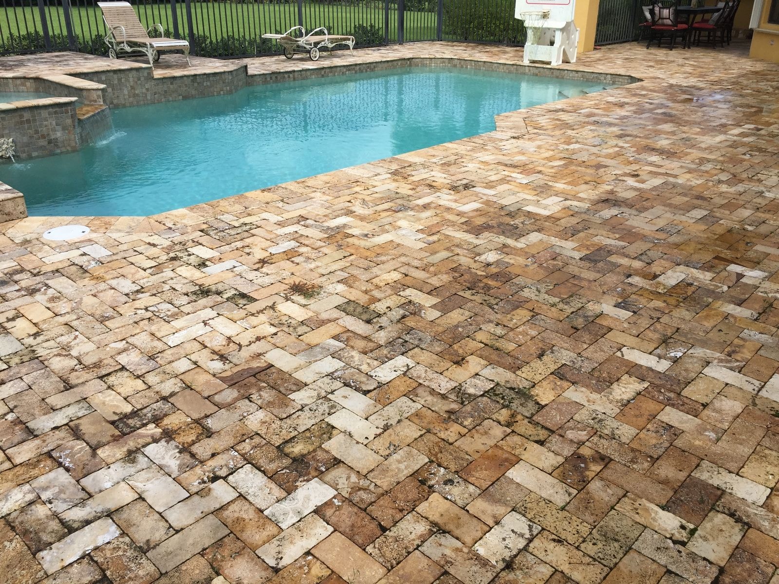 Before: Travertine pool deck before cleaning, Palm Beach Gardens, FL