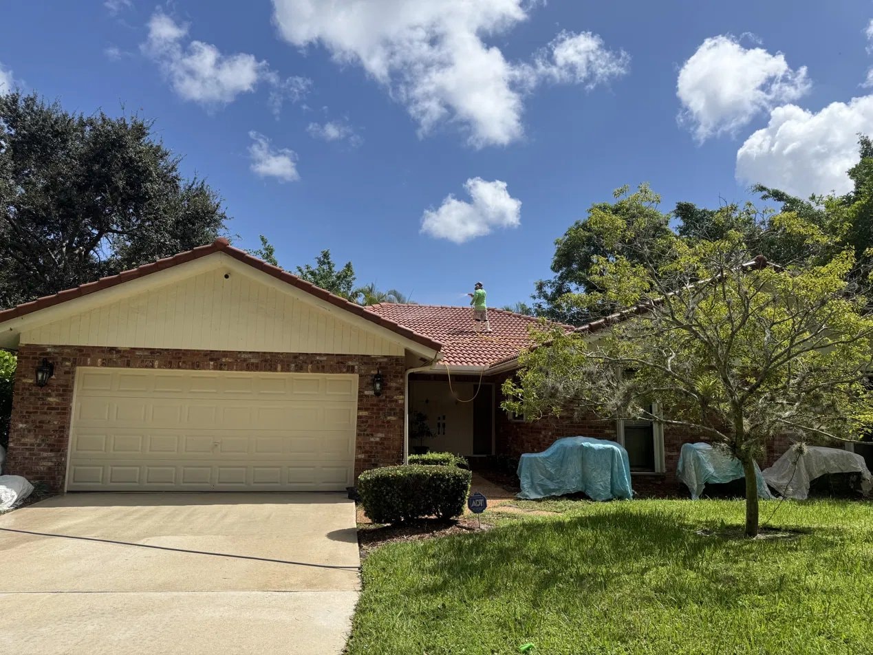 After: Soft-wash roof cleaning and driveway pressure washing - barrel tile roof, Boca Raton, FL — after treatment