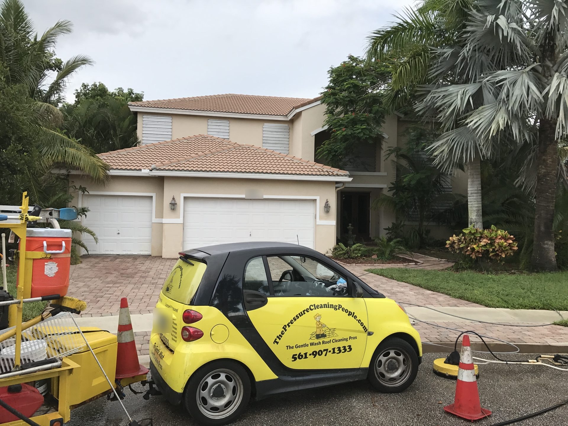 Soft-wash roof cleaning crew and equipment on site, Greenacres, FL