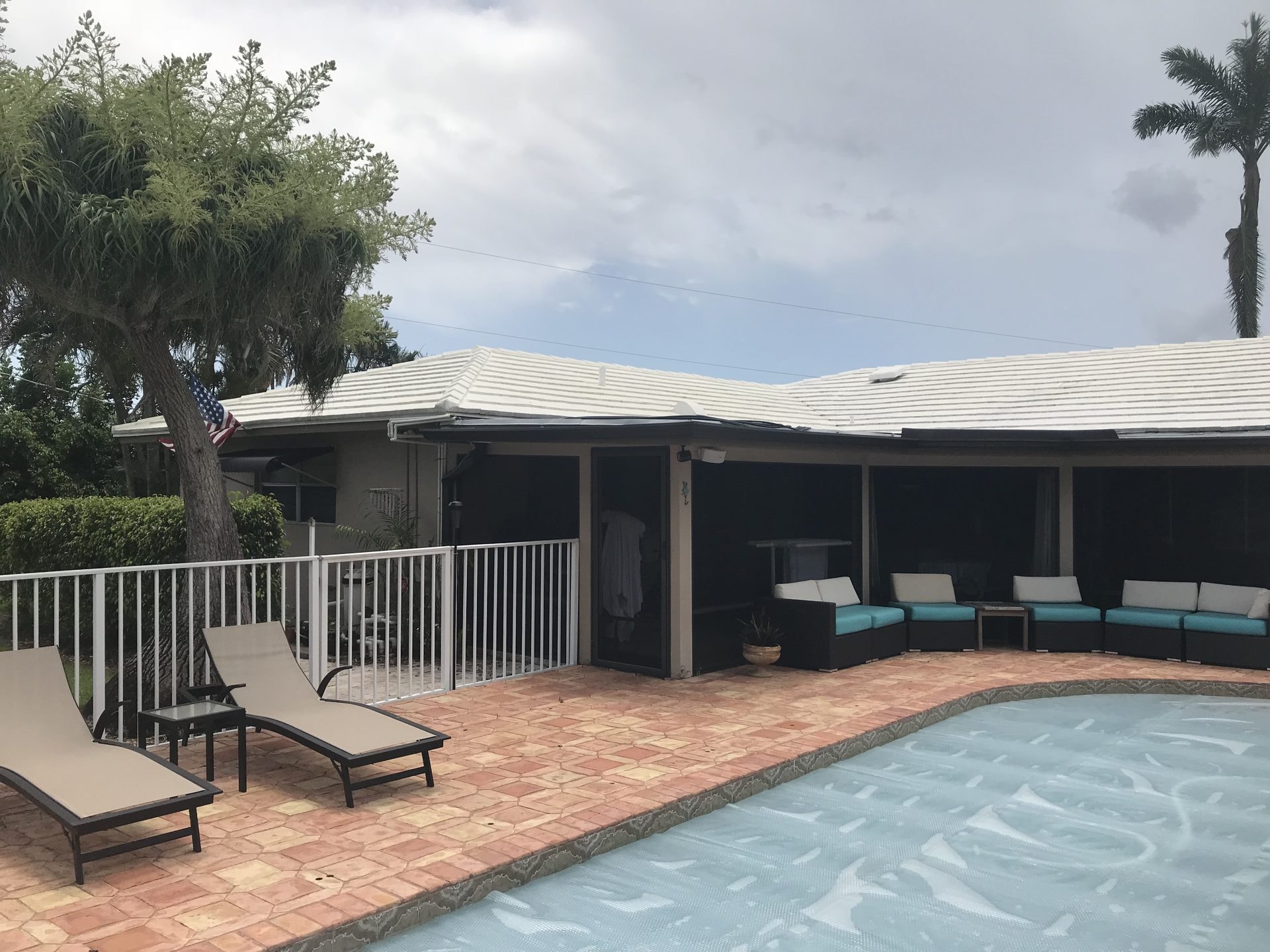 White flat tile roof after soft-wash cleaning, Greenacres, FL