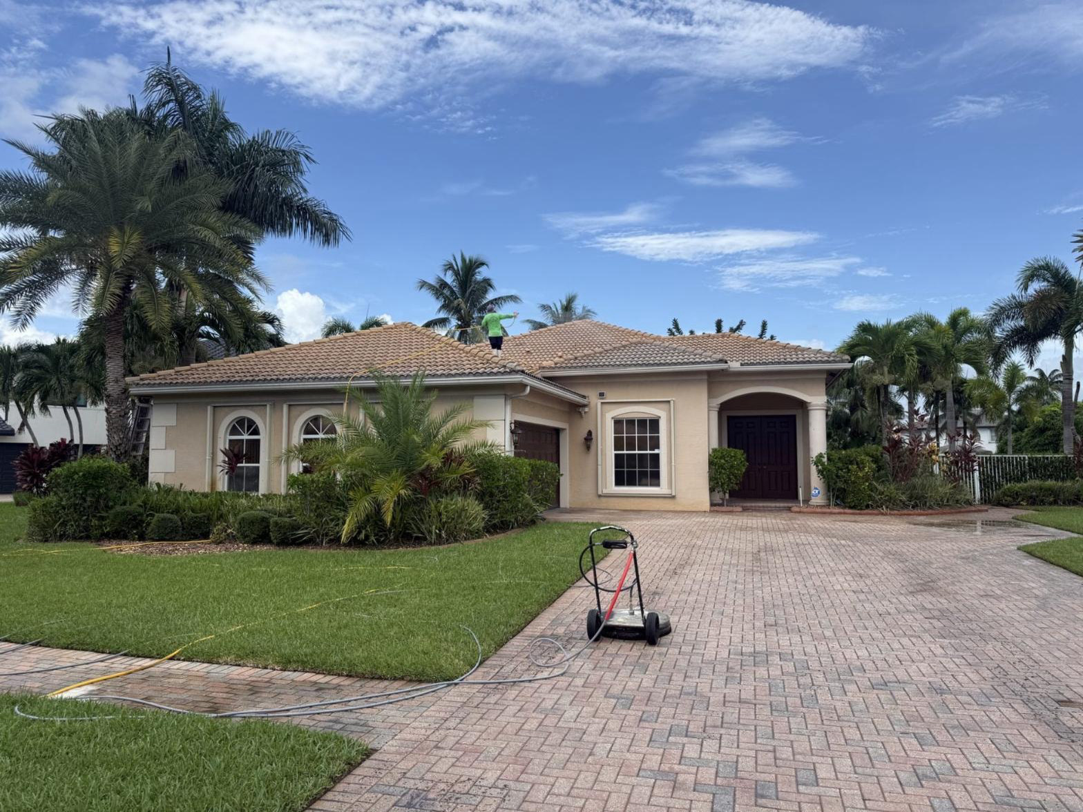 Before: Barrel tile roof and paver driveway in Royal Palm Beach, FL before cleaning