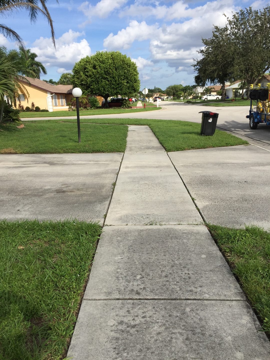 HOA sidewalk with dirt and algae buildup before cleaning, Greenacres, FL