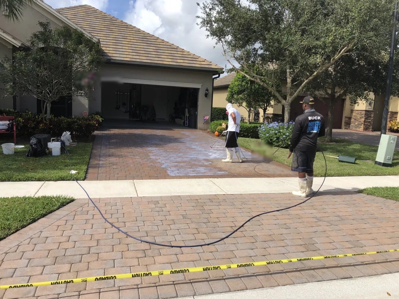 After: Paver driveway pressure washing and sealing - Wellington, FL — after service