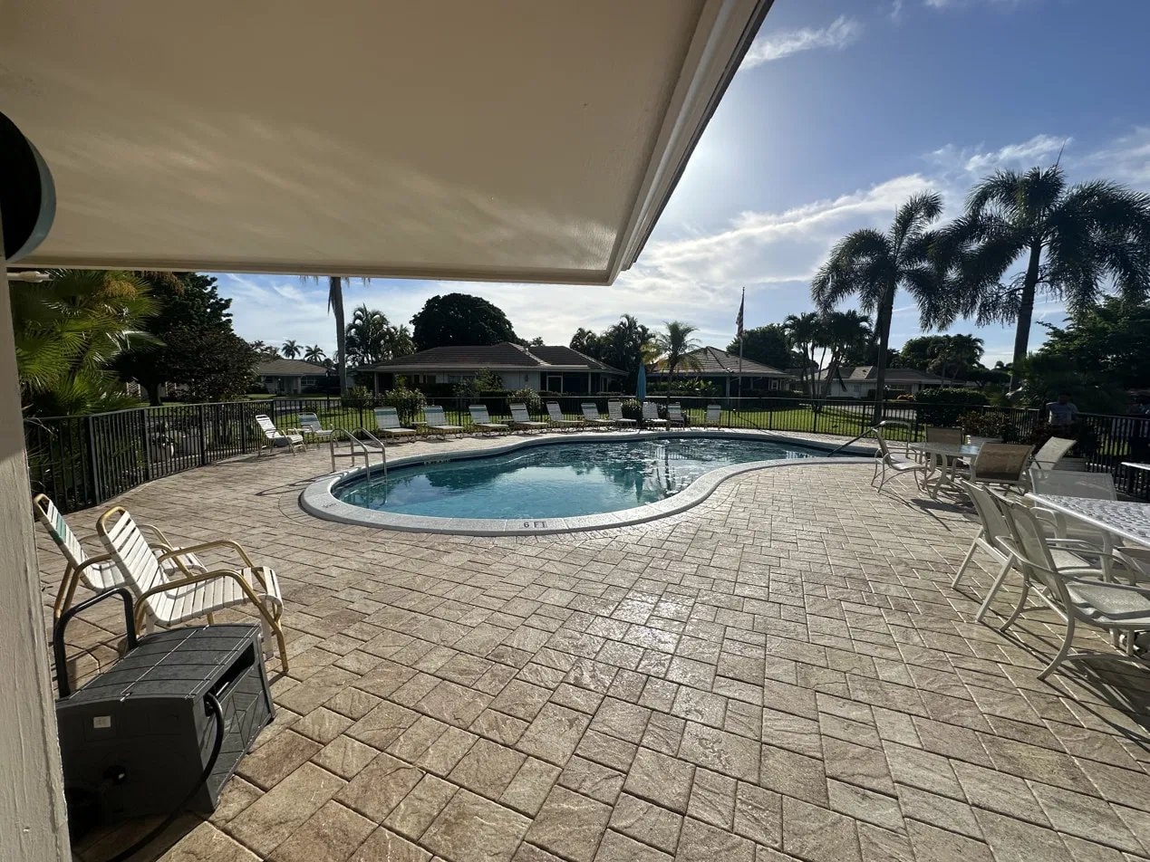 After: Clean and sealed HOA pool deck with no weeds in the paver joints in Atlantis, FL