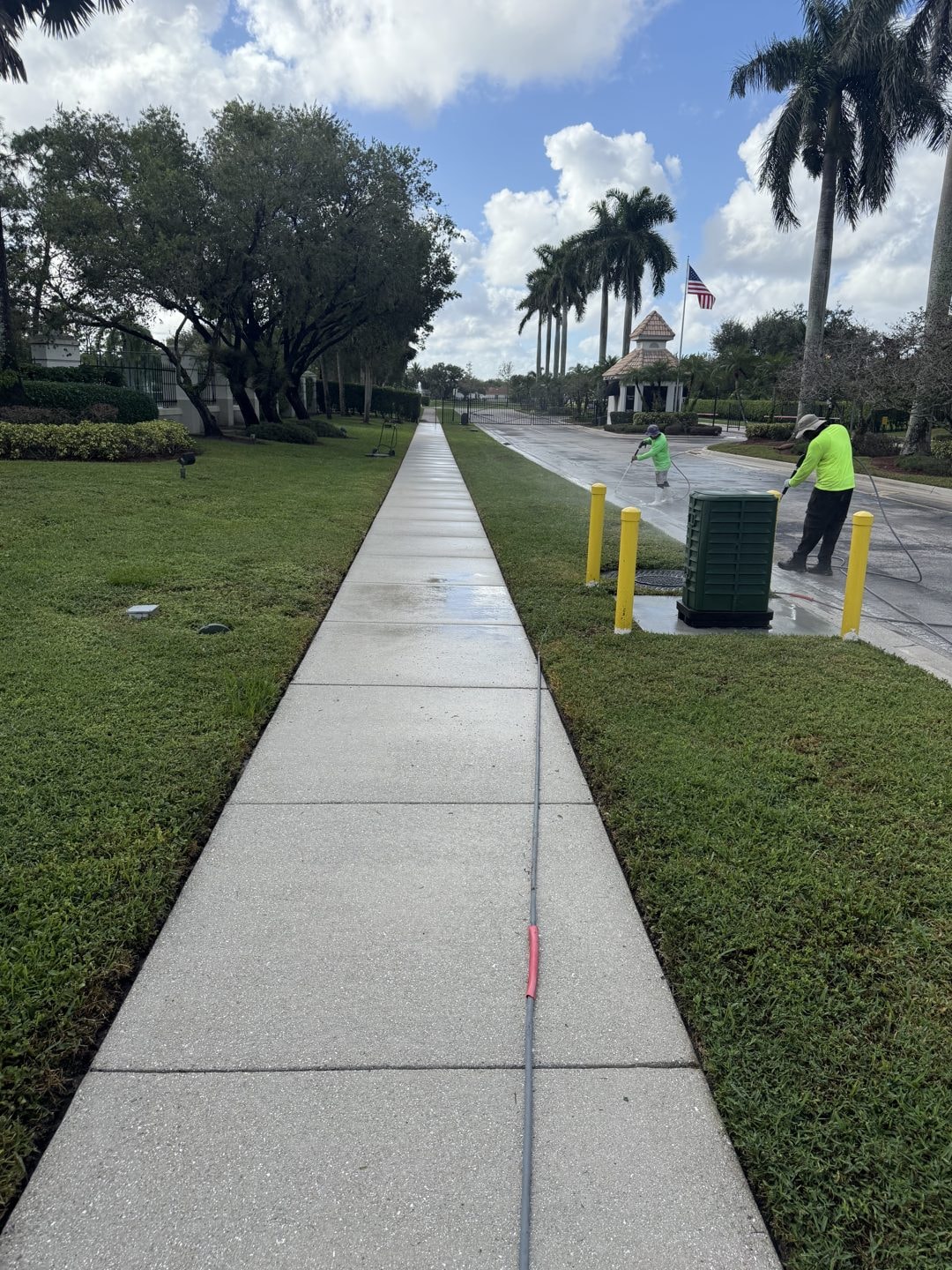The same Wellington, FL HOA sidewalk and swale after cleaning