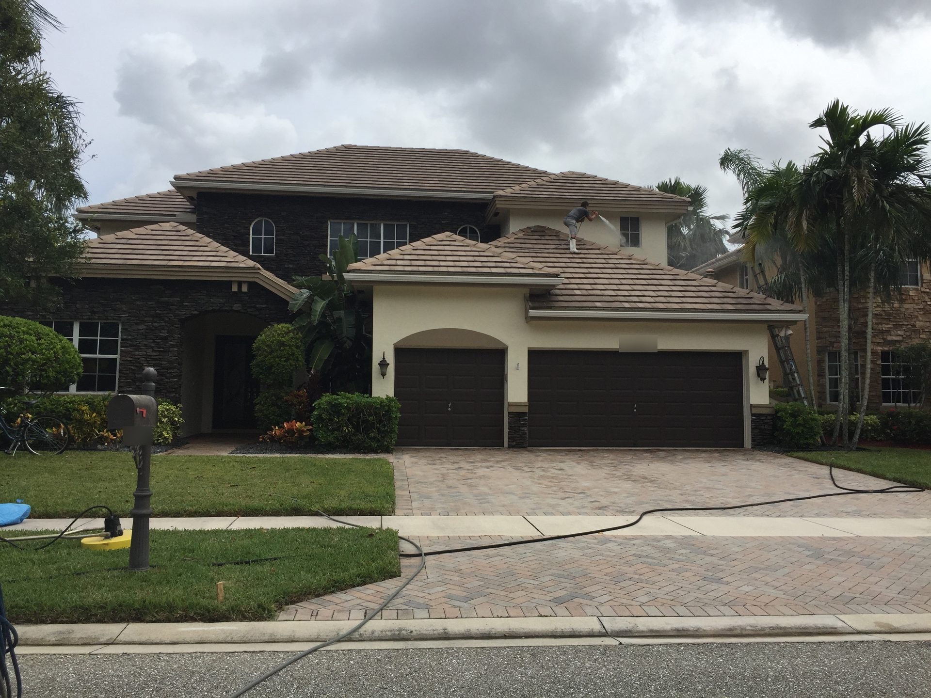 The same Wellington, FL tile roof restored to a clean, uniform tone after soft washing
